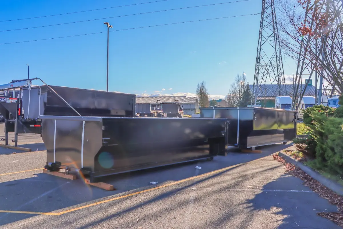 Roll-off dumpster ready for waste disposal at job site for 2 Yard Dumpster Rental in Woburn